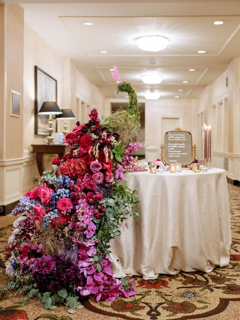 Colorful floral peacock installation created for an Indian wedding reception at Pittsburgh's Omni William Penn Hotel.