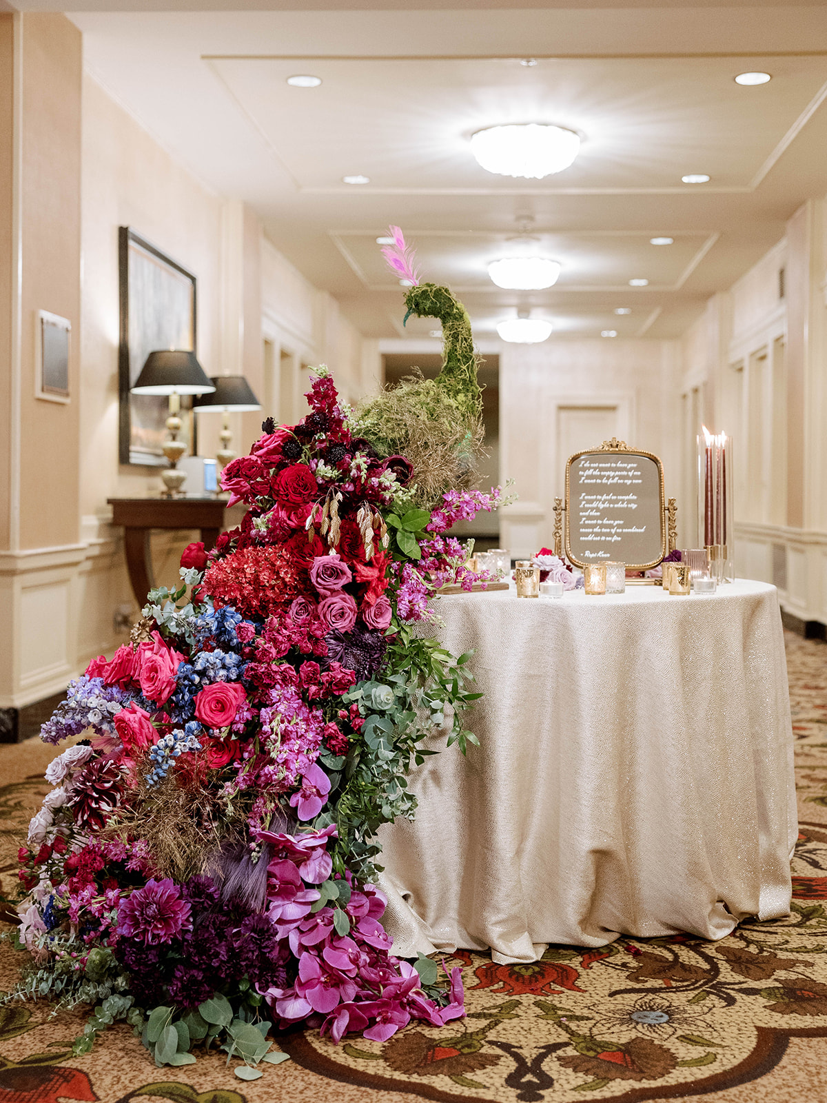 Colorful floral peacock installation created for an Indian wedding reception at Pittsburgh's Omni William Penn Hotel.