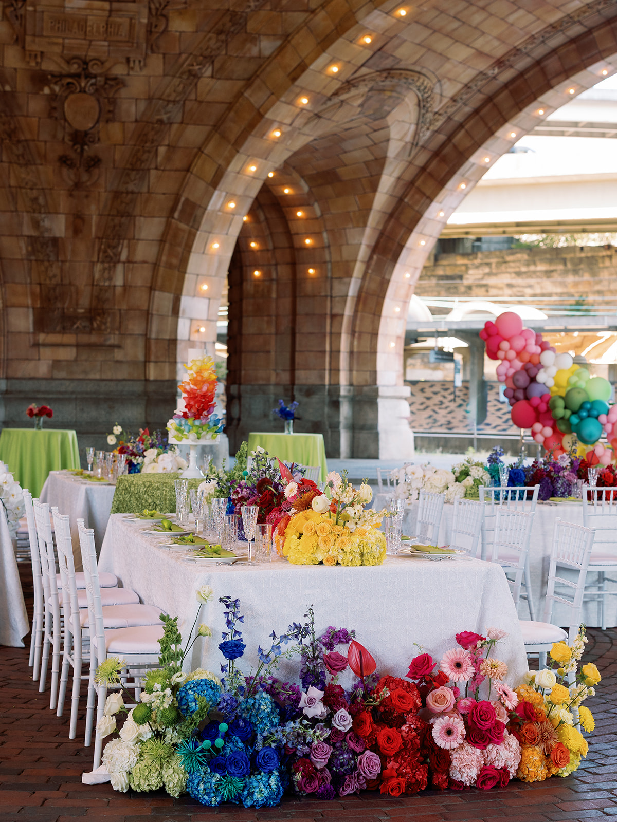 Saturated colorful rainbow wedding tablescape by Mary Beth McConahey at The Pennsylvanian
