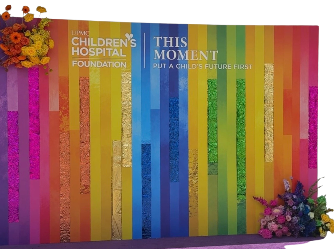 Rainbow color-block backdrop with floral installation created for a Children's Hospital fundraising gala in Pittsburgh